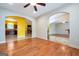 Spacious living room with hardwood floors, open archways to dining and kitchen at 4050 Old Fairburn Rd, Atlanta, GA 30349