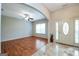 Cozy living room with hardwood floors and arched entry to foyer at 4050 Old Fairburn Rd, Atlanta, GA 30349