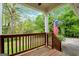 Front porch with wooden railing and American flag at 4050 Old Fairburn Rd, Atlanta, GA 30349
