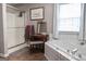Bathroom with a walk-in shower and soaking tub; features decorative elements and a clean, inviting design at 500 Hayfield Ct, Locust Grove, GA 30248