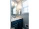 Half bathroom featuring a vanity with a sink, mirror, and updated fixtures at 500 Hayfield Ct, Locust Grove, GA 30248