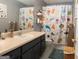 Charming bathroom with an animal-themed shower curtain, vanity, and decorative details at 500 Hayfield Ct, Locust Grove, GA 30248