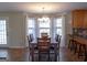 Bright dining area with a large window and view into the kitchen at 500 Hayfield Ct, Locust Grove, GA 30248