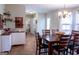 Dining area featuring a large table for six, wine rack, and natural light at 500 Hayfield Ct, Locust Grove, GA 30248
