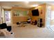 Bright carpeted playroom with lots of space for playing and displaying toys and decorations at 500 Hayfield Ct, Locust Grove, GA 30248