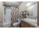 Well-maintained bathroom featuring a shower-tub combo and vanity with plenty of storage at 133 Springer Rd, Whitesburg, GA 30185