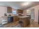 A modern kitchen with island and stainless steel appliances at 133 Springer Rd, Whitesburg, GA 30185