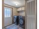 Practical laundry room with modern washer and dryer, plus convenient storage options at 133 Springer Rd, Whitesburg, GA 30185