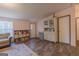The living room has wood-look flooring and neutral walls at 133 Springer Rd, Whitesburg, GA 30185