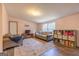 A cozy living room with neutral walls and wood-look flooring at 133 Springer Rd, Whitesburg, GA 30185