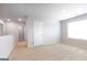 Spacious bedroom filled with natural light, neutral paint, and carpet at 161 Aster Ave, Locust Grove, GA 30248