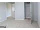 Bedroom with neutral paint and carpet, and a open closet at 161 Aster Ave, Locust Grove, GA 30248