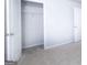 View of open closet with shelving and neutral colored walls and carpet at 161 Aster Ave, Locust Grove, GA 30248