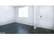 Entryway with hardwood floors, a window, and a white front door at 161 Aster Ave, Locust Grove, GA 30248