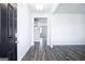 Entryway featuring dark wood floors and views of the home's open floor plan at 161 Aster Ave, Locust Grove, GA 30248