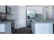 Well-equipped kitchen featuring stainless steel appliances, granite countertops, white cabinets, and a center island at 161 Aster Ave, Locust Grove, GA 30248