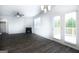 Open-concept living room with a fireplace, and hardwood floors at 161 Aster Ave, Locust Grove, GA 30248
