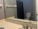 Bathroom with a sink, mirror, vanity, toilet, and shower with a curtain at 9340 Basswood Way, Jonesboro, GA 30236