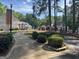 Exterior view of community buildings with well-maintained landscaping and walkways at 9340 Basswood Way, Jonesboro, GA 30236