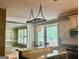 Kitchen area with bar, table and chairs, and view to backyard at 9340 Basswood Way, Jonesboro, GA 30236