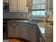 Light-filled kitchen with granite countertops, stainless steel appliances, and plenty of cabinet space at 9340 Basswood Way, Jonesboro, GA 30236