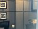 Stylish powder room with vessel sink, mirror and black toilet at 9340 Basswood Way, Jonesboro, GA 30236