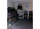 Basement game room with classic arcade game cabinets and stools at 9340 Baswood Way, Jonesboro, GA 30236