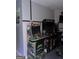 Basement game room with classic arcade game cabinets and a stool at 9340 Baswood Way, Jonesboro, GA 30236
