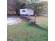 Overhead view of backyard with a shed and a dilapidated swimming pool at 1217 Dove Ct, Morrow, GA 30260