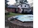 Backyard featuring a closed swimming pool surrounded by an overgrown lawn at 1217 Dove Ct, Morrow, GA 30260