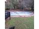 Backyard featuring a closed swimming pool surrounded by an overgrown lawn at 1217 Dove Ct, Morrow, GA 30260