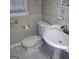 This bathroom features a standard white toilet and a pedestal sink at 1217 Dove Ct, Morrow, GA 30260