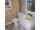 A standard toilet sits near a drop in sink in this bathroom at 1217 Dove Ct, Morrow, GA 30260