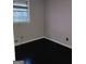 Bright bedroom featuring dark wood floors, neutral walls and a window with natural light at 1217 Dove Ct, Morrow, GA 30260