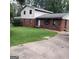 Two-story home with brick and white siding and a green lawn and concrete driveway at 1217 Dove Ct, Morrow, GA 30260