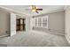 Bedroom featuring a large closet for storage, neutral walls, plush carpet, and natural light at 119 Brookgrove Ln, Peachtree City, GA 30269