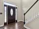 Welcoming foyer with a decorative front door, sidelights, and staircase at 119 Brookgrove Ln, Peachtree City, GA 30269