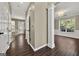 Hallway leading into another room with hardwood flooring and white doors at 119 Brookgrove Ln, Peachtree City, GA 30269