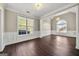 Spacious area with natural light, hardwood floors and tasteful wall paneling at 119 Brookgrove Ln, Peachtree City, GA 30269