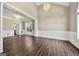 Spacious living area with modern light fixtures, neutral paint, and large window for natural light at 119 Brookgrove Ln, Peachtree City, GA 30269
