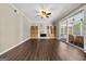 Open living room featuring a fireplace with built-in shelving and access to a screened in porch at 119 Brookgrove Ln, Peachtree City, GA 30269