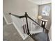 View from the top of staircase overlooking the foyer and front door at 119 Brookgrove Ln, Peachtree City, GA 30269