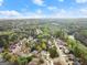 An aerial view showing the homes and surrounding neighborhood, near the river at 735 River Ridge Ln, Suwanee, GA 30024