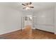 Bedroom with hardwood floors, ceiling fan, large closet, and French doors to the hallway at 735 River Ridge Ln, Suwanee, GA 30024