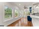 Bright area with hardwood floors, large windows providing natural light and views to the outside at 735 River Ridge Ln, Suwanee, GA 30024