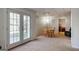 A basement recreation area with a dining table and French doors leading to the outside at 2032 Stonewick Ct, Lawrenceville, GA 30043