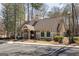 Community clubhouse featuring grey siding, stone columns and green shutters at 2032 Stonewick Ct, Lawrenceville, GA 30043