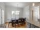 Dining area adjacent to kitchen featuring hardwood floors and natural lighting at 2032 Stonewick Ct, Lawrenceville, GA 30043