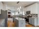 Spacious kitchen with granite countertops, stainless steel appliances, and open view to living room at 2032 Stonewick Ct, Lawrenceville, GA 30043
