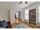 Well-lit office featuring hardwood floors, a bookshelf, and an interior doorway at 2032 Stonewick Ct, Lawrenceville, GA 30043